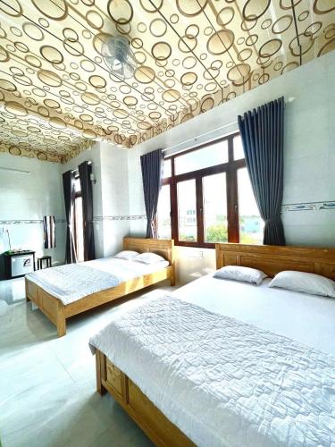 Postel nebo postele na pokoji v ubytování Thành Trinh hotel đảo Phú Quý