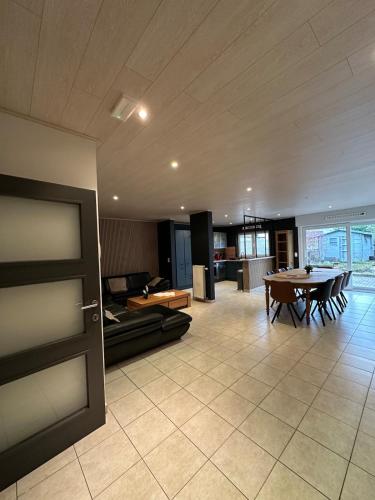 a large living room with a table and a couch at The175 work or holiday home in Comines