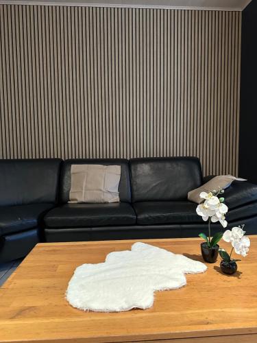 a living room with a couch and a coffee table at The175 work or holiday home in Comines