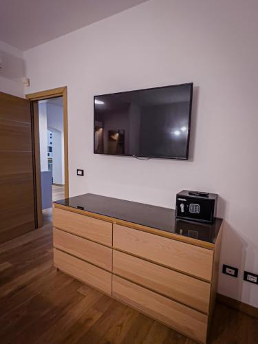 a living room with a flat screen tv on a wall at Appartamento Principe in Monterosso al Mare