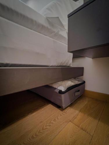 an empty bunk bed in a room with a wooden floor at Appartamento Principe in Monterosso al Mare