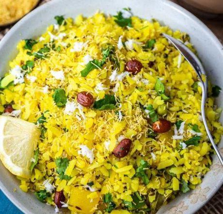 a bowl of rice with a lime and a spoon at ILIF 2726 Beach Haven in Nāgaonkhar