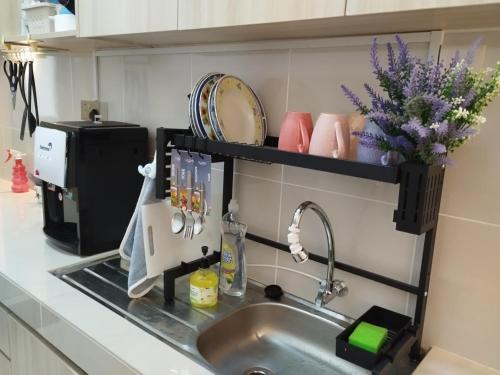 a kitchen sink with a shelf above it at Kampar Lake House - Bandar Baru Kampar City Centre in Kampar