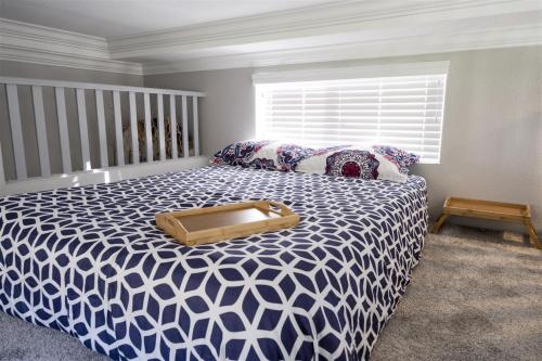 a bedroom with a bed with a wooden box on it at Blue Pacific in Fort Bragg