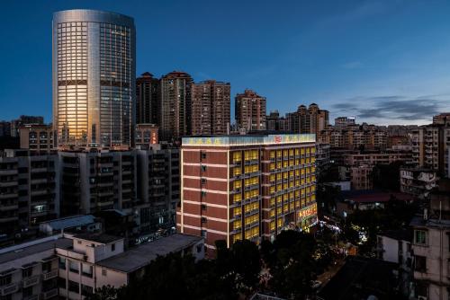 a view of a city with a tall building at Mei Gang Hotel in Guangzhou