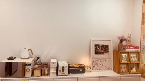 a kitchen counter with a microwave and other items on it at Im Youngchon in Gangneung