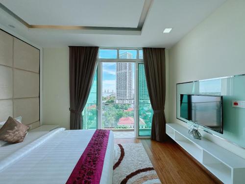 a hotel room with a bed and a large window at Infinity 28 Hotel and Residence in Phnom Penh