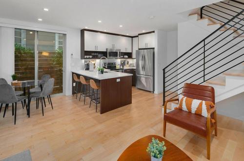a kitchen and living room with a staircase in a house at Perch - Centro House A in Seattle