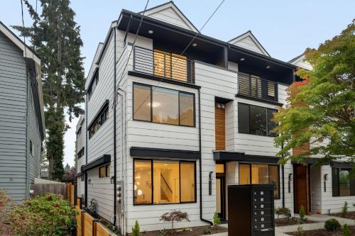 a white house with black trim and windows at Perch - Ballard Bliss in Seattle