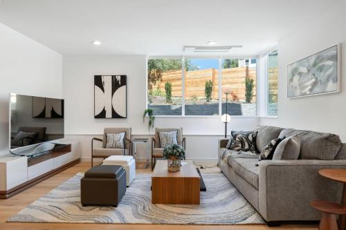 a living room with a couch and a table at Perch - View Ridge Guest Suite in Seattle