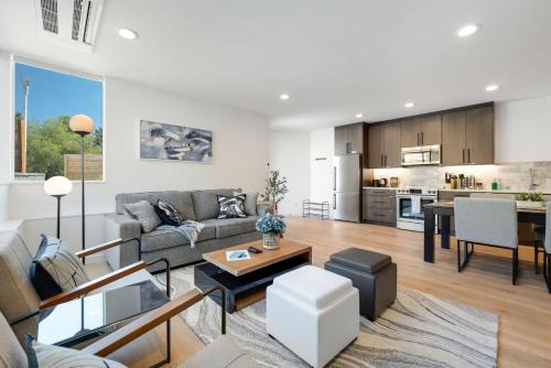 a living room with a couch and a table at Perch - View Ridge Guest Suite in Seattle