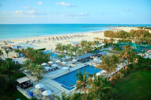 an aerial view of a resort with a beach at I Like Al Hamra Palace - Elite Beach & Golf Resort Private Suites in Ras al Khaimah