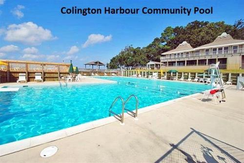 a large swimming pool in front of a resort at CH103- Beach Retreat in Kill Devil Hills
