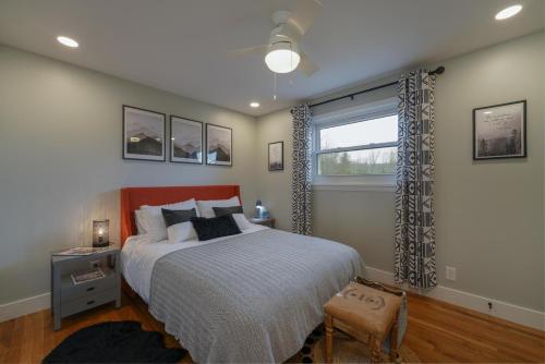 a bedroom with a large bed and a window at JB`s Place in Brevard
