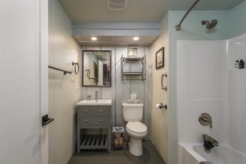a small bathroom with a toilet and a sink at JB`s Place in Brevard
