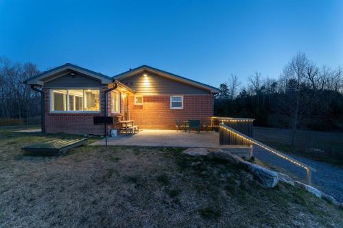 a small house with a porch and a patio at JB`s Place in Brevard