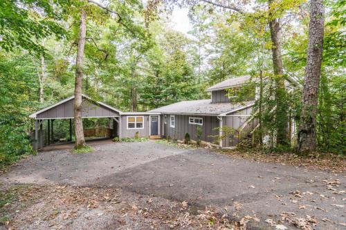 a home in the woods with a driveway at New Listing! Two Houses - 4 Minutes to Dahlonega in Dahlonega