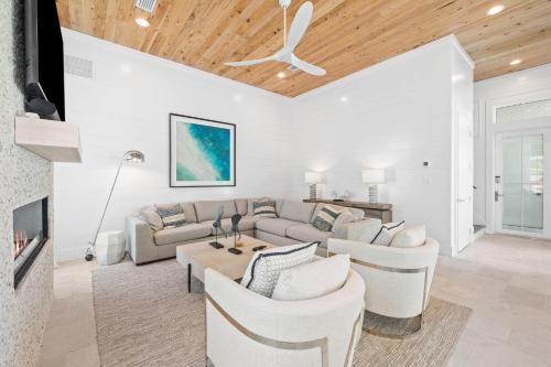 a living room with a couch and chairs at Bullish On Beaches in Inlet Beach