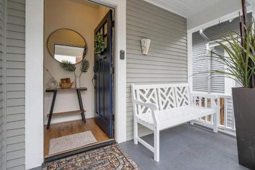 a porch with a white bench next to a door at Perch - Queen Ann Vintage Charm in Seattle
