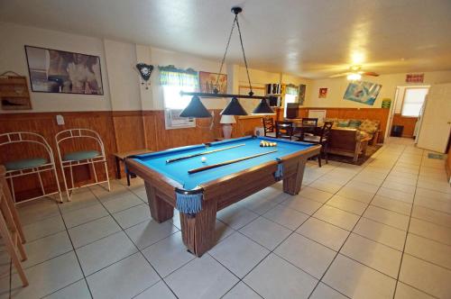 a living room with a pool table in it at KH4004- Paradise in Kitty Hawk