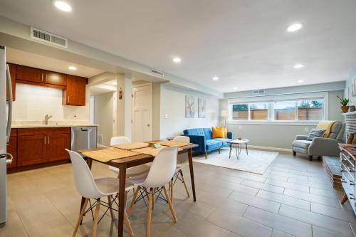 a kitchen and living room with a table and chairs at Perch - Shoreline Gathering Spot in Shoreline
