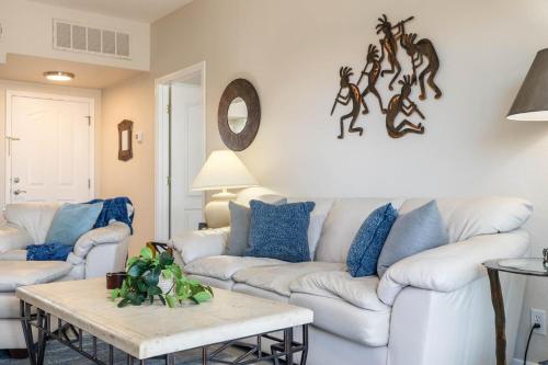 a living room with a white couch and a table at Little Fountain in Fountain Hills