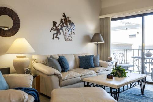 a living room with a couch and a table at Little Fountain in Fountain Hills