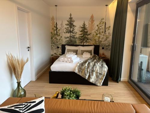 a bedroom with a large bed with teddy bears on it at Hello Pilis Apartments in Pilisszentkereszt