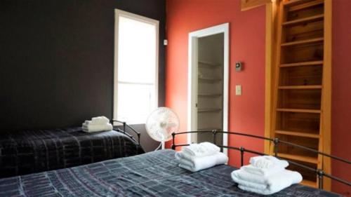 a bedroom with two beds and a fan at Forest Rim I1, WV in Waterville Valley