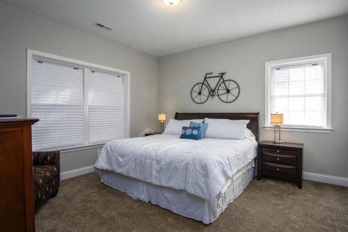 a bedroom with a bed with a bike on the wall at BKs Hideaway in Pisgah Forest