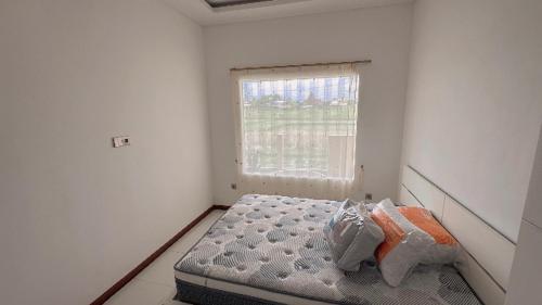 Ένα ή περισσότερα κρεβάτια σε δωμάτιο στο Vila Oma