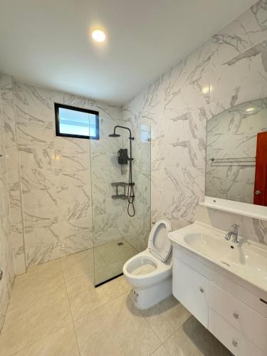 a bathroom with a shower and a toilet and a sink at Dragon Pool Villa Aonang in Ao Nam Mao