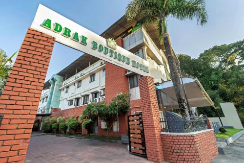 a hotel with a sign that reads arusha boutique at Itsy Hotels Adrak in Trivandrum