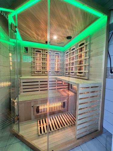 a wine cellar with green lights in a room at Villa Diamond Hill in Sarajevo