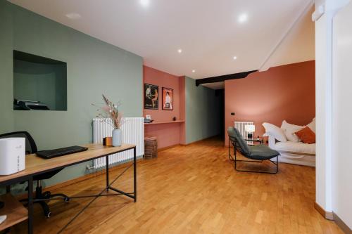 an office with a desk and a living room at Ivrea Centro storico, 300m dal castello in Ivrea