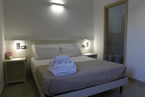 Giường trong phòng chung tại CALALUNA COUNTRY HOUSE - PUNTA PROSCIUTTO