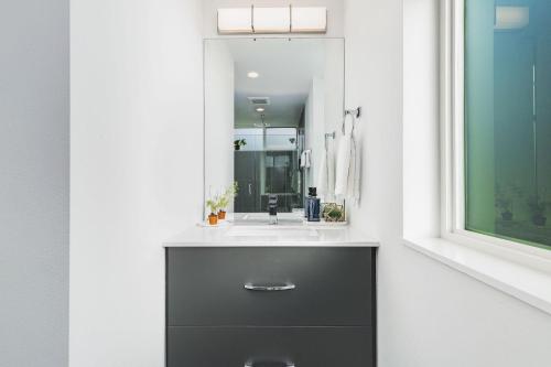 a bathroom with a sink and a mirror at Perch - Belmont Boutique 2 in Seattle