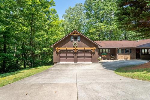 a house with a garage and a driveway at Peace of Heaven in Connestee in Brevard