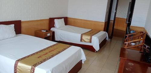 Ένα ή περισσότερα κρεβάτια σε δωμάτιο στο Viet Thai Hotel