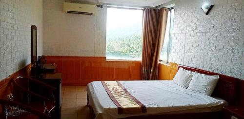 Ένα ή περισσότερα κρεβάτια σε δωμάτιο στο Viet Thai Hotel
