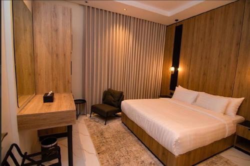 a hotel room with a bed and a desk at princes house in Jeddah