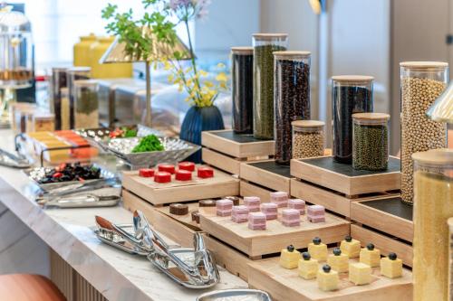 a table with wooden boxes of food on it at Holiday Inn Express Haikou World Trade Center by IHG in Haikou