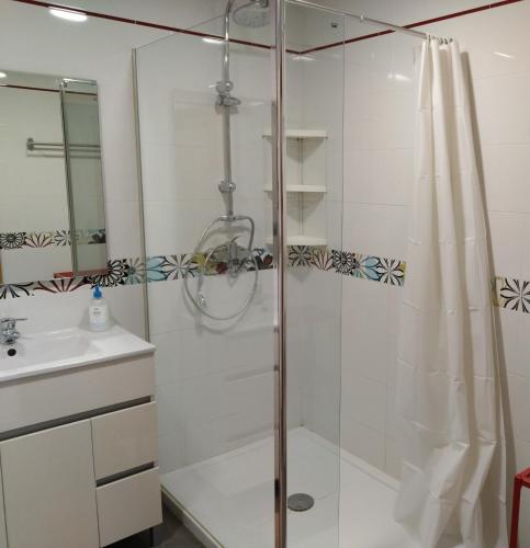 a bathroom with a shower and a sink at The Lemon Grove House - large private garden, private pool - perfect for families in Torremolinos