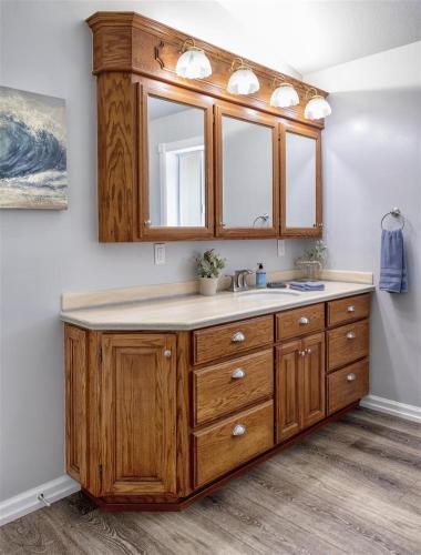 a bathroom with a sink and a mirror at Coastal Hideaway in Fort Bragg