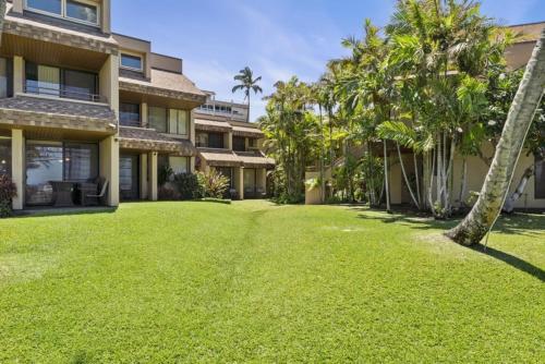 an empty yard in front of a building at Kamaole Beach Club B107 in Kihei