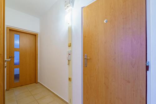 a room with a door and a hallway with a door at EVerLuck město in Loket