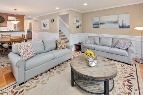 a living room with a couch and a table at Perch - Cozy Ensuites in Seattle