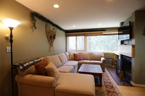a living room with a couch and a table at Snowsbrook 15, WV in Waterville Valley