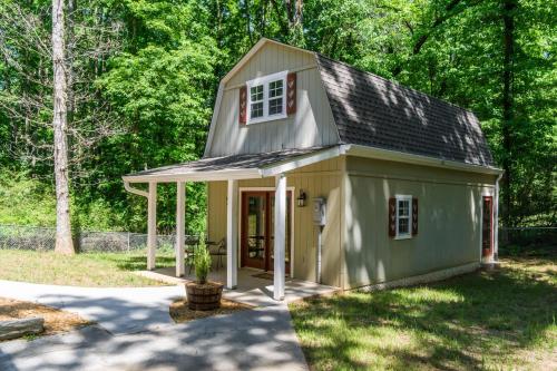 a green tiny house with a gambrel roof at Downtown Family Retreat - 5 Beds & 3.5 Baths in Dahlonega