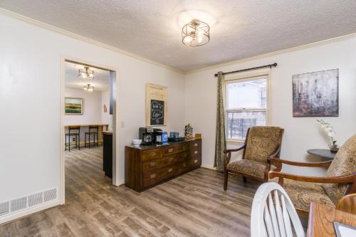 a living room with a desk and a chair at Downtown Family Retreat - 5 Beds & 3.5 Baths in Dahlonega